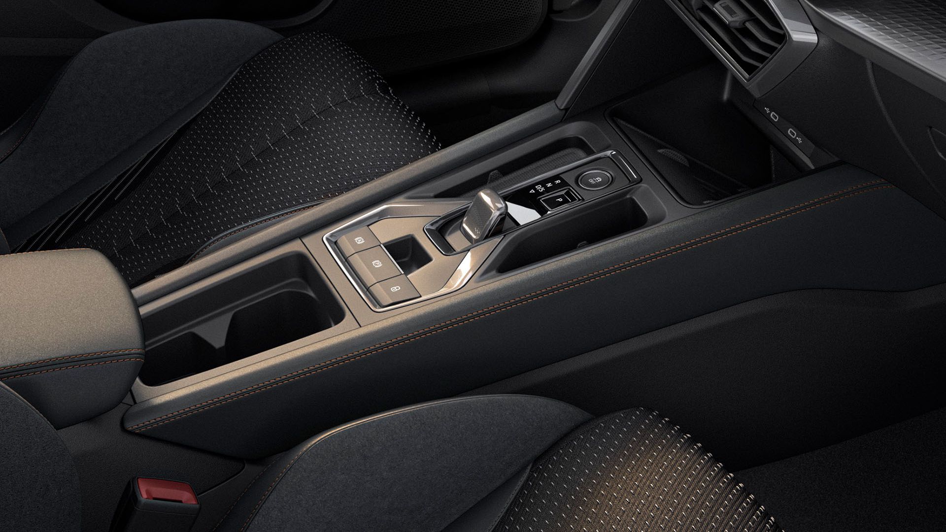 Interiér vozidla so zameraním na stredovú konzolu a voliacu páku. Konzola je vybavená moderným dotykovým ovládaním.