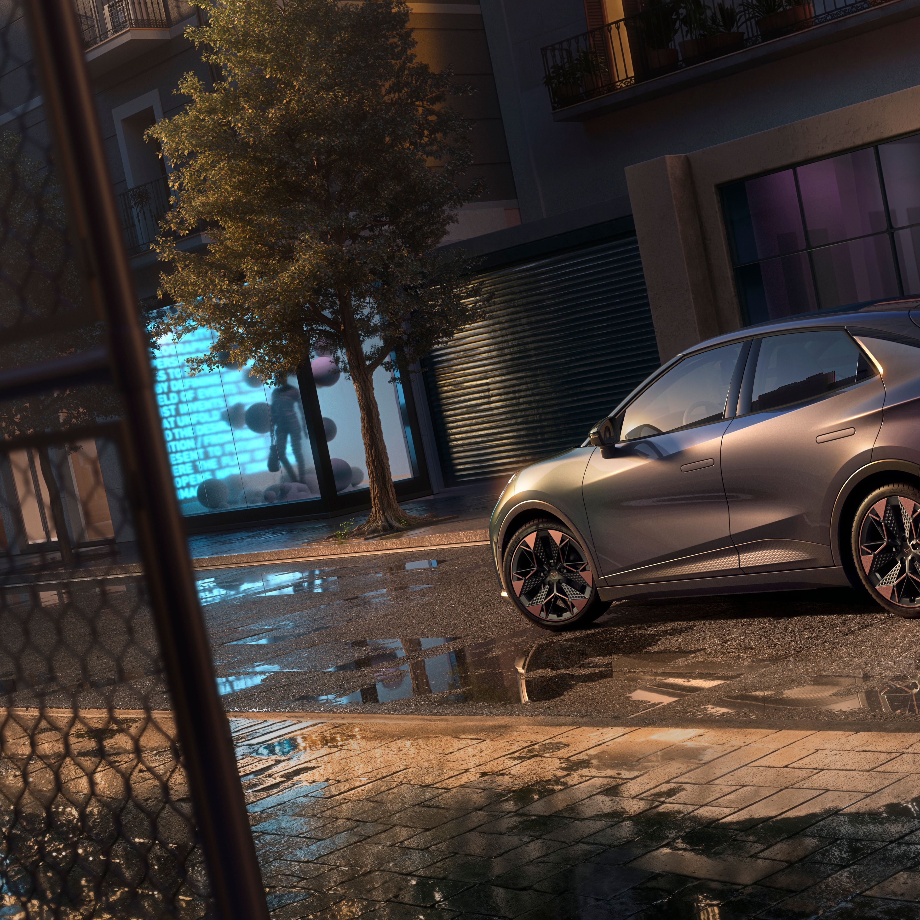 Detailný záber na zadné partie vozidla CUPRA Raval VZ v odtieni Plasma s 19-palcovými diskami, ktorý je zaparkovaný na mestskej ulici v noci.